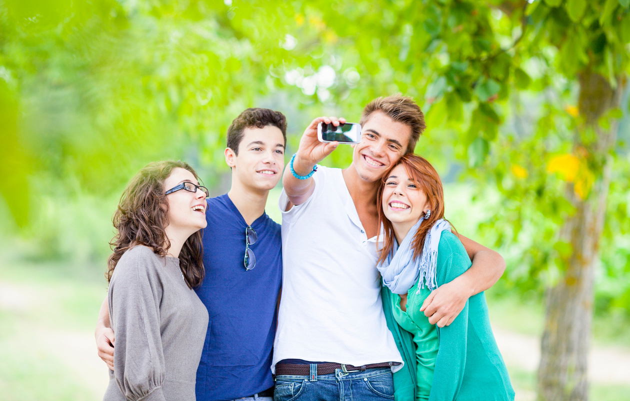Group of Teenagers Taking Photos with Mobile